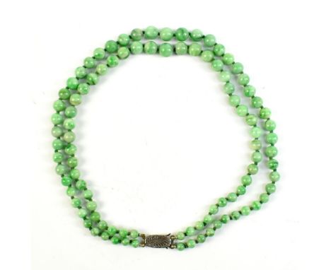 A jade double strand bead necklace with sterling silver clasp.Additional InformationMinimal wear but good condition.