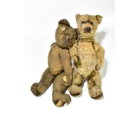 An early 20th century teddy bear with button eyes, pronounced snout and hunch back and jointed limbs, length 46cm, and a late