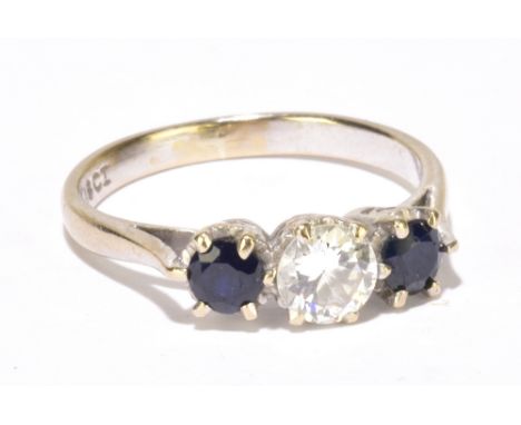 An 18ct white gold diamond and sapphire three stone ring, the central round brilliant cut diamond weighing approx 0.50ct, fla