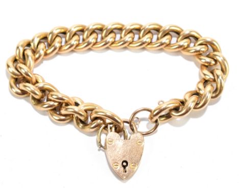 A 15ct yellow gold curb link bracelet with padlock clasp, length 18cm, approx 29.7g.Additional InformationGeneral wear, the p