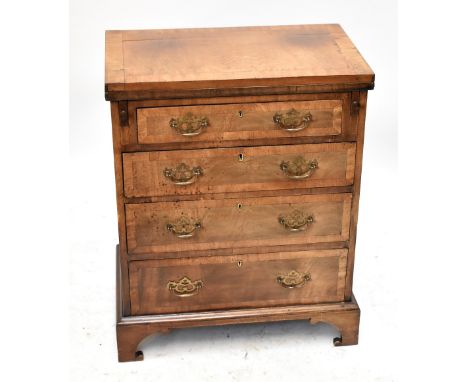 A small 19th century mahogany crossbanded bachelor's chest of four graduated drawers with fold out top supported on twin brus