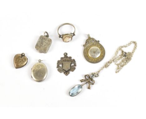 A small mixed group of jewellery including two hallmarked silver watch fobs/medals, three lockets, a ring set with carved cam