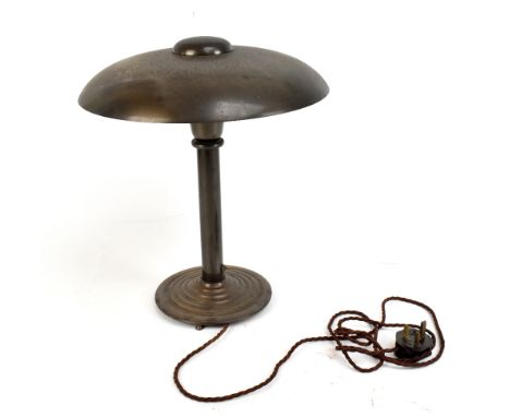 A 1970s bronzed metal desk lamp with circular top raised on single column terminating on stepped plinth base, diameter of top