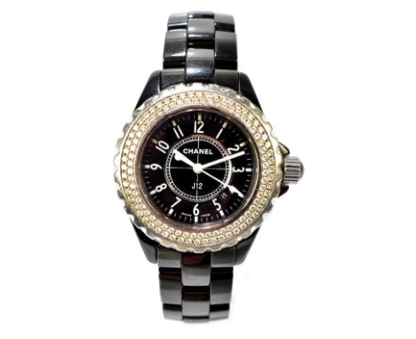 CHANEL; a lady's J12 stainless steel and diamond set wristwatch, the circular dial set with Arabic numerals within a bezel se