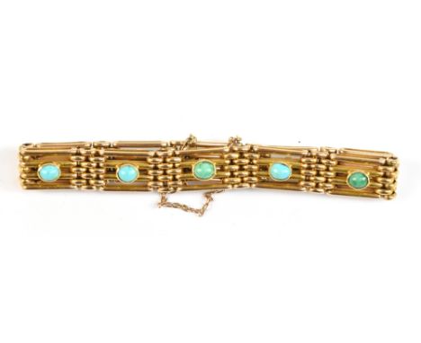 A 15ct yellow gold gate link bracelet inset with ten turquoise coloured stones, approx 26.4g.Additional InformationStamped '1