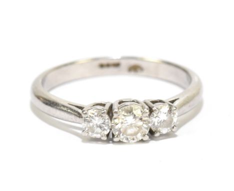 A platinum and diamond three stone ring, the central stone approx 0.33ct, approx size K 1/2, weight approx 3.8g.Additional In