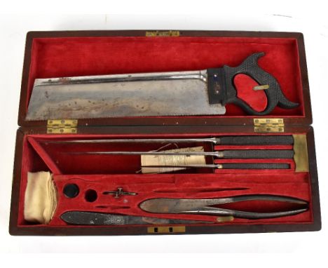 A 19th century mahogany and brass bound cased surgeon's kit including saw, three graduated blades, curved needles, pliers, an