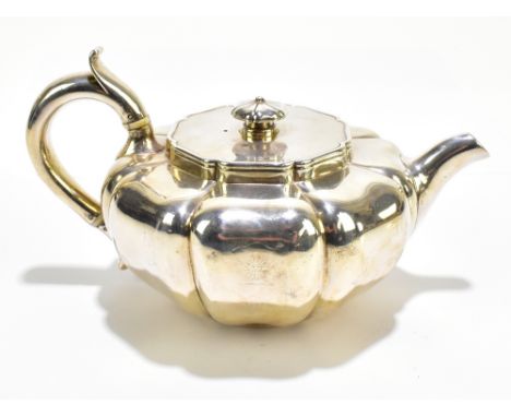 JOHN BRIDGE; a William IV hallmarked silver teapot of squat form with panelled body, bears indistinct family crest, length 22