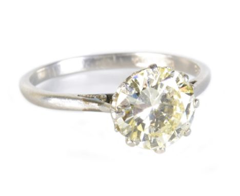 A platinum and diamond solitaire ring, the round brilliant cut stone weighing approx 1.75cts in eight claw setting, size L 1/