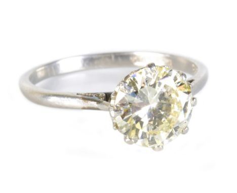 A platinum and diamond solitaire ring, the round brilliant cut stone weighing approx 1.75cts in eight claw setting, size L 1/