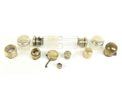 A 19th century double ended clear cut glass scent bottle with unmarked silver lids, one screw and one hinged, latter with sto