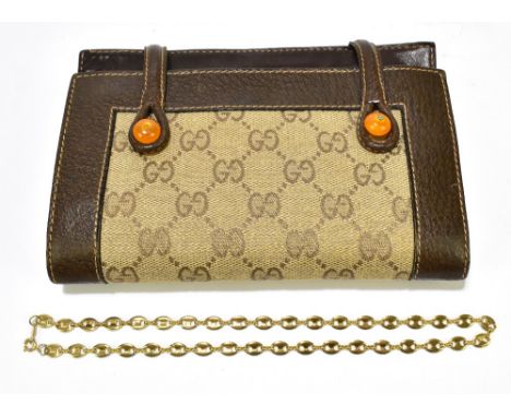 GUCCI; a cloth GG monogram and soft brown leather jewellery travel case with two button front, four zip compartments for jewe