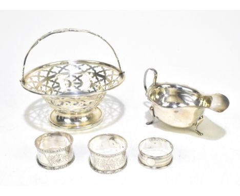 CHARLES COOKE; an Edward VII hallmarked silver basket with pierced detail and swing handle on spreading circular foot, Cheste