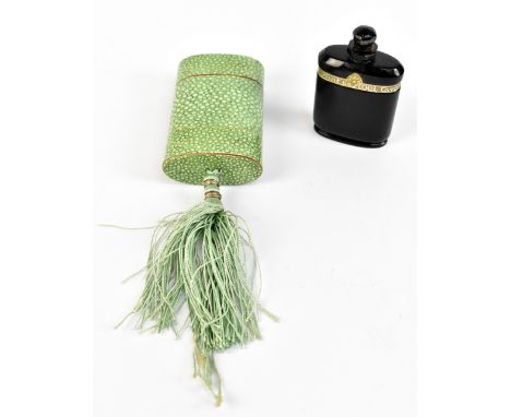 An Art Deco amethyst coloured glass Nuit de Noel perfume bottle, inset within a faux shagreen cardboard case, length 8.5cm.Ad