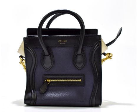 CELINE; a small Phantom navy blue, cream and black leather shoulder bag with gold tone hardware, detachable shoulder strap an