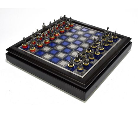 THE FRANKLIN MINT; 'The Gold &amp; Silver Edition Waterloo Chess Set', with board, boxed.Additional InformationWear to box, s