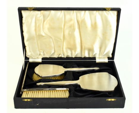 ADIE BROS LTD; a cased Elizabeth II&nbsp;hallmarked silver four piece dressing table set with engine turned&nbsp;decoration,&