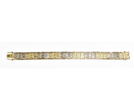 A 9ct yellow and white gold bracelet with floral decoration, length 18.5cm, approx 16.4g.Additional InformationMinimal wear, 