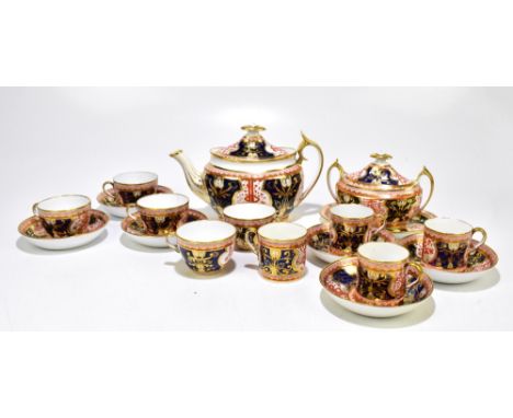 SPODE; an Imari decorated part tea set comprising teapot on stand, length 27cm, twin handled sugar bowl, five teacups, six sa