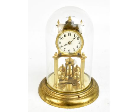 A gilt metal anniversary clock, the circular dial set with Arabic numerals, the back plate no.156720, on circular base and pr