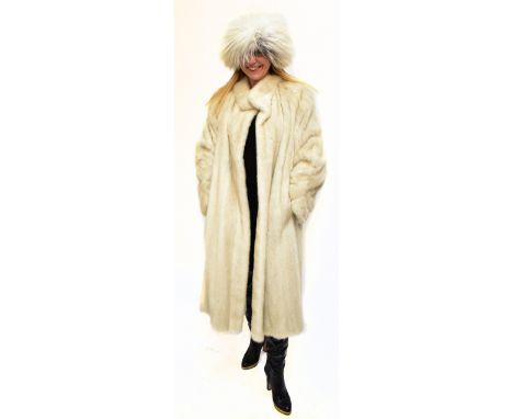 A silver white full length mink coat, labelled M &amp; Michaels Furs of Bristol, and London label '1670 The Mink', a vintage 