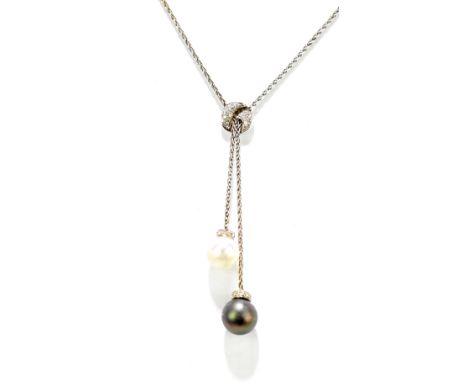 An 18ct white gold diamond and pearl necklace with twin pearl drops set within a collar of tiny diamonds and with further dia
