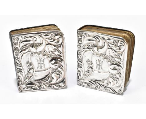 JOSEPH &amp; RICHARD GRIFFIN; a pair of Edward VII hallmarked silver mounted Common Prayer and Hymns Ancient &amp; Modern boo