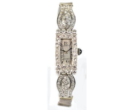 A lady's Art Deco platinum and diamond set wristwatch, the silvered dial set with Arabic numerals and with sapphire winding c