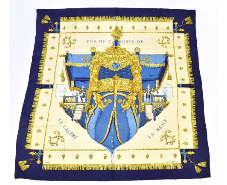 HERMÉS; a blue and gold silk scarf, 'Vue de Carrosse De La Gale're' by Hugo Grygkar, first issued in 1953 but re-issued, unsi