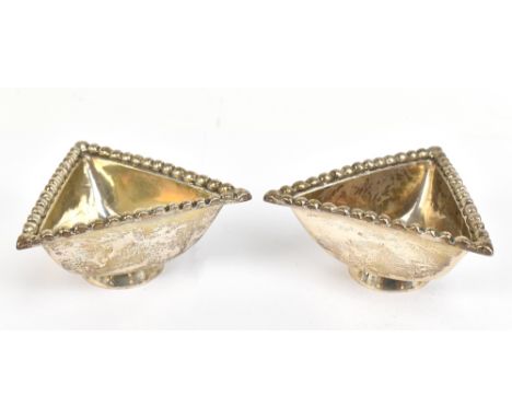 TRAPRAIN TREASURE; a pair of George V hallmarked silver pedestal triangular shaped bowls, each with cast beaded rims, Edinbur