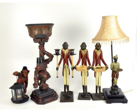 A set of three reproduction monkey in jacket figures including a twin sconce candelabrum example, height 42cm, a resin monkey