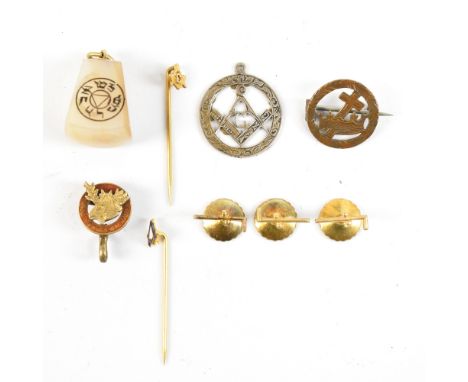 A group of Masonic yellow and gilt metal stick pins, badges and buttons including an enamelled example with stylised animal h