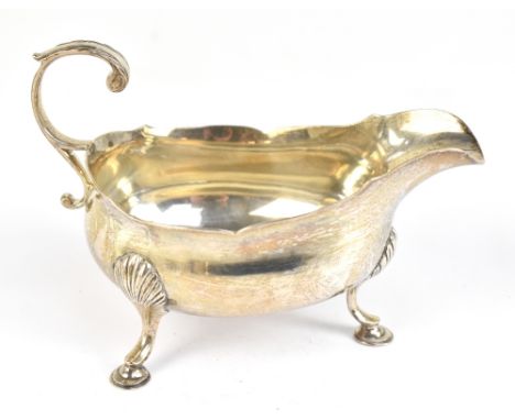 ROBERT HENNELL I; a George III hallmarked silver sauce boat, raised on three pad feet, London 1772, approx weight 3.58ozt/109