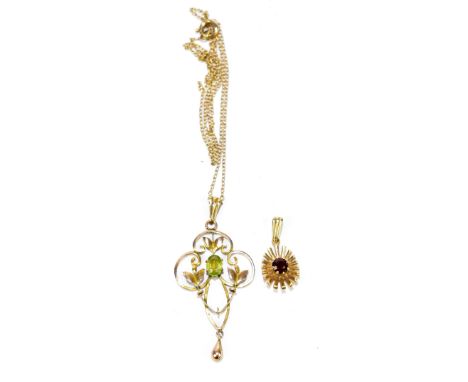 An Edwardian yellow metal peridot pendant mounted on a 9ct yellow gold chain, length 25cm, together with a 9ct yellow gold pe