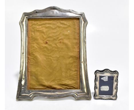 C &amp; C HODGETTS; a George V hallmarked silver easel back photograph frame, Birmingham 1919, 26 x 20cm, together with a mod