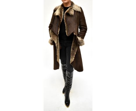 DOM &amp; RUBY; a brown sheepskin leather coat with fur trim, collar and cuffs, with front fastenings, size UK 12.Additional 