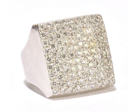 A large white metal and diamond set ring, the broad pavé square sectioned domed mount set with approx eighty diamonds, size K