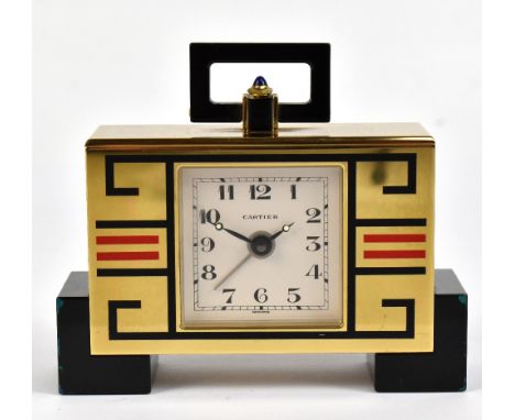 CARTIER; an Art Deco style gilt brass desk clock with red and black geometric decoration, the signed square dial set with Ara