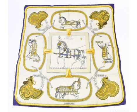 HERMÈS; a 100% silk twill gold, cream and blue 'Grand Apparat' scarf by Jacques Eudel depicting horse print motifs.Additional