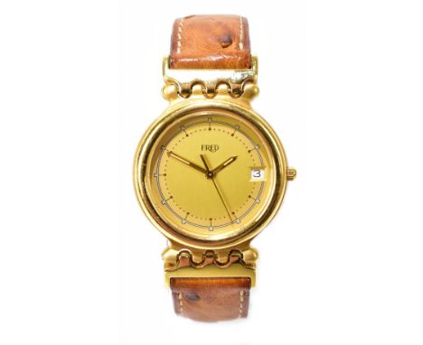 FRED TIGRESS; a lady's 18ct yellow gold wristwatch, the circular dial set with date aperture and on leather and part yellow g