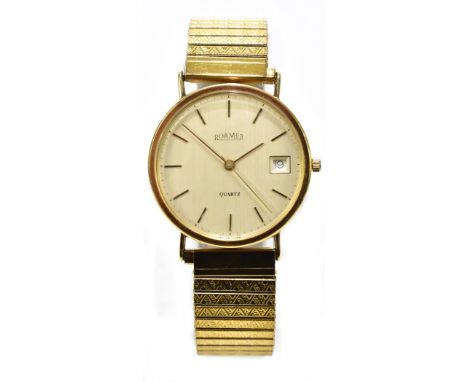 ROAMER; a 9ct yellow gold gentleman's quartz wristwatch, the circular dial set with date aperture and gold baton markers, on 