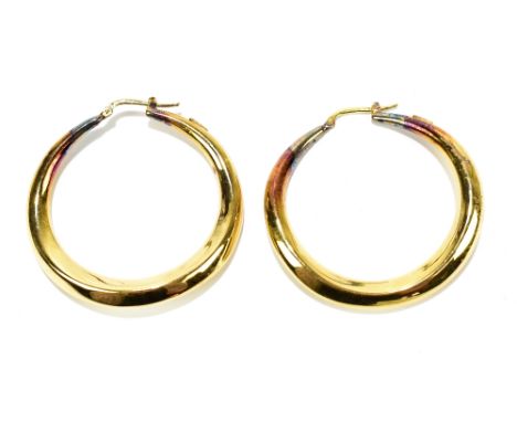A pair of 18ct yellow gold hoop earrings of hollow form, diameter approx 46mm, approx 9.9g.Additional InformationSome tarnish