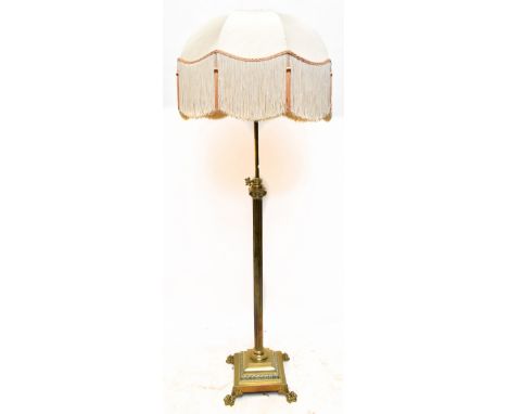 A brass telescopic Corinthian column standard lamp on stepped square section base to paw feet, height enclosing fitment 148cm