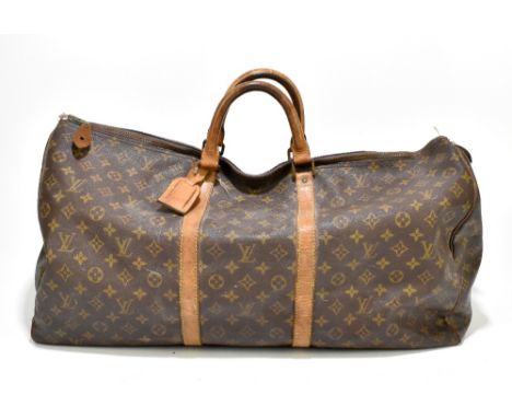 LOUIS VUITTON; a circa 1980s vintage brown monogram Keepall Bandoliere 60 (lacking shoulder strap).Additional InformationThe 