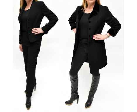 CAROLINE CHARLES; a cashmere and wool mid-length black coat with black velvet collar and cuff, covered front buttons and pock