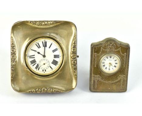 WILSON &amp; GREEN; a hallmarked silver easel back watch case with repoussé floral detail, Birmingham 1908, housing a silver 