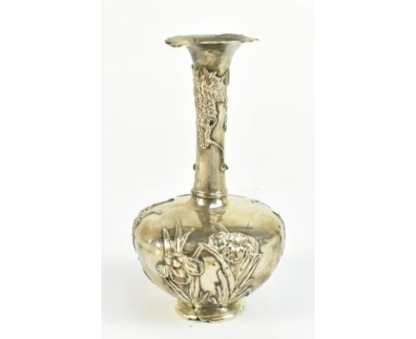 An early 20th century Japanese silver bottle vase with floral moulded rim and relief decoration, jungin mark to base, height 