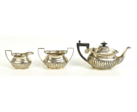 MARSTON &amp; BAYLISS; an Edward VII&nbsp;hallmarked silver tea service with gadrooned&nbsp;decoration to the body,&nbsp;Birm