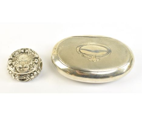 A Continental 800 grade silver oval tobacco/snuff box, the hinged lid with engine turned detail and vacant belt motif cartouc