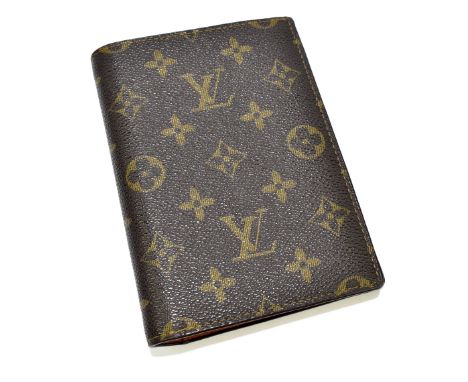LOUIS VUITTON; a large vintage monogram leather canvas wallet/card holder with sections for ID cards, with spaces for twelve 